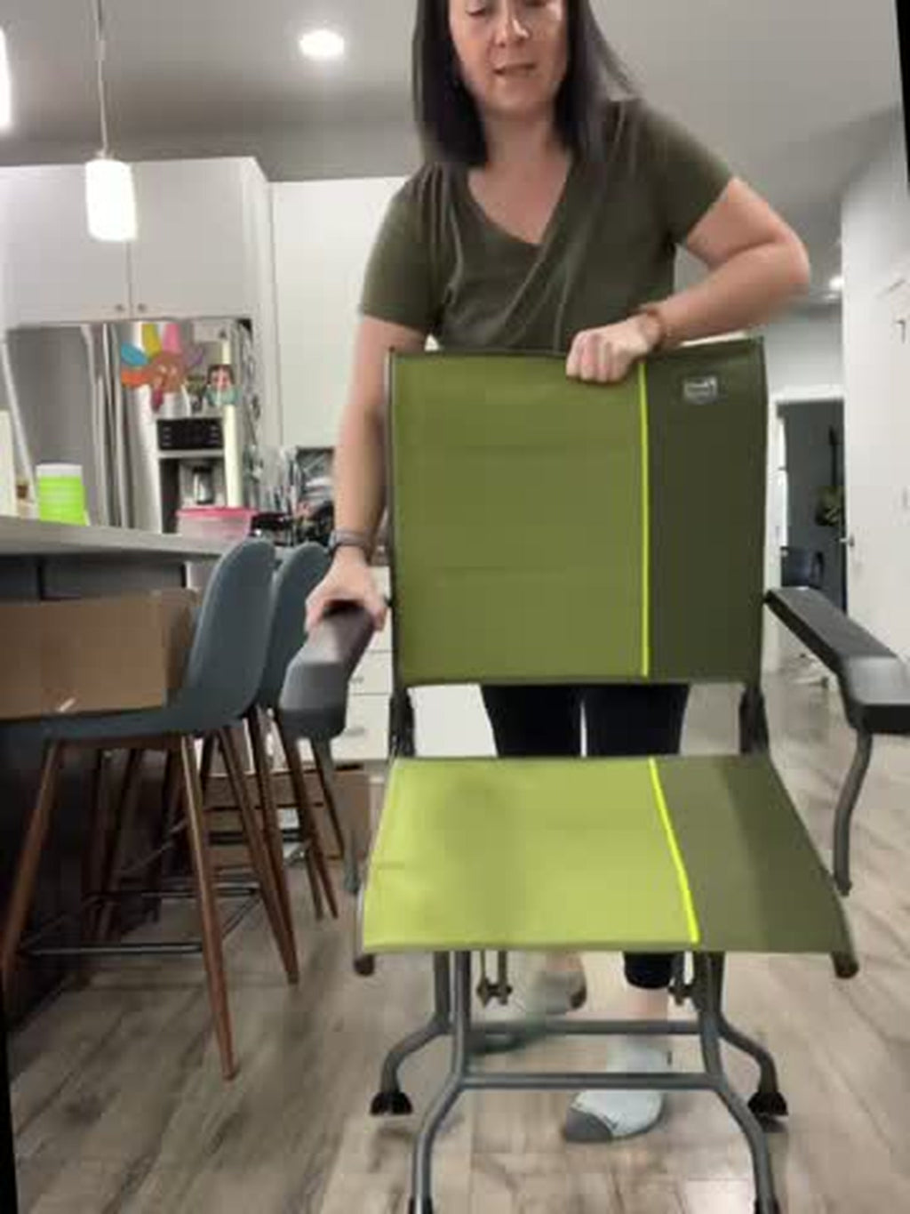 Olive green portable glider chair with solid armrests